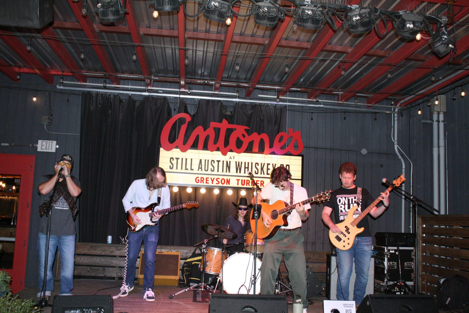 Full band on stage at Still Austin